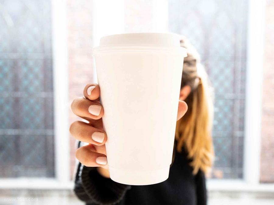 25xt-5050067 Free-Woman-Holding-Cup-Mockup-PSDCupsz3.jpg