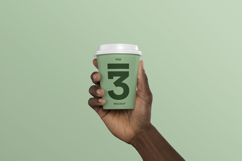 Hand Holding Coffee Cup Mockup.jpg